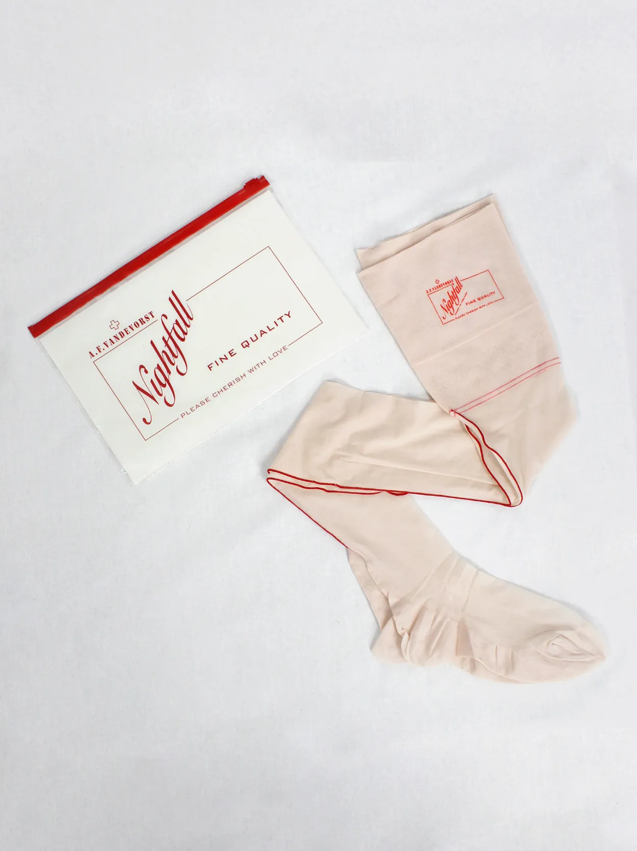 A.F. Vandevorst Nightfall blush pink stockings with red back seam — spring 1999