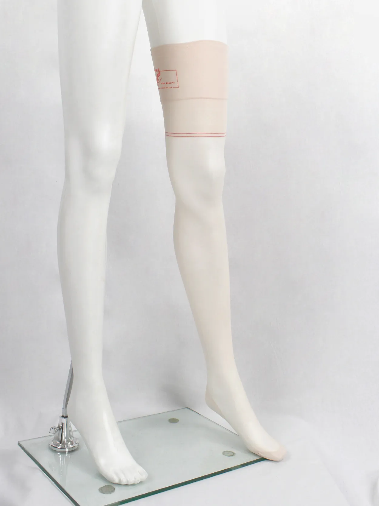 A.F. Vandevorst Nightfall blush pink stockings with red back seam — spring 1999