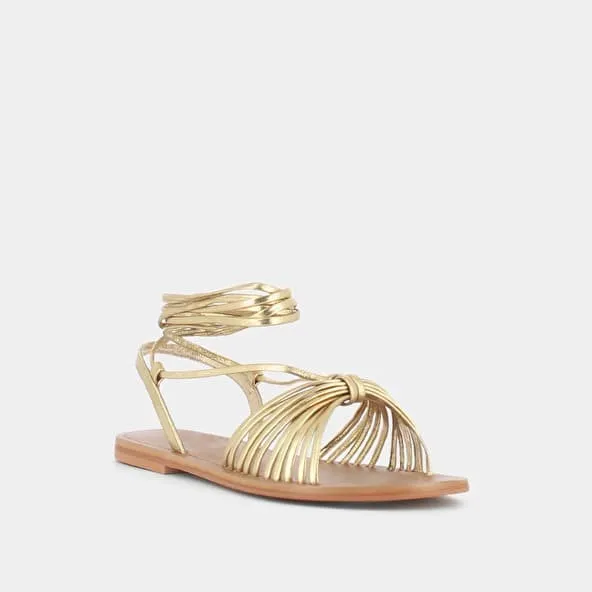 Sandals with ties in gold metallic leather