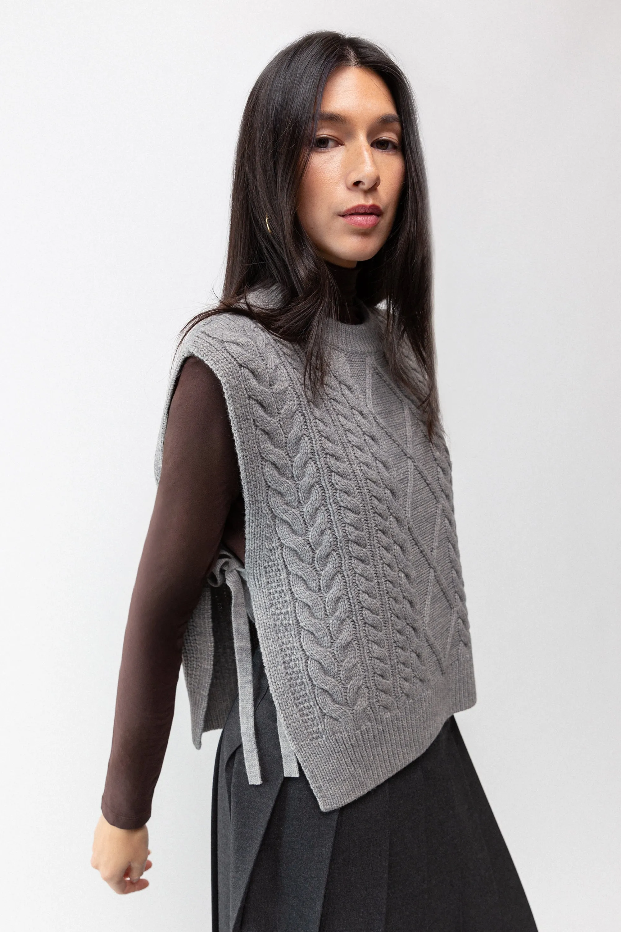 SLEEVELESS CABLE-KNIT VEST WITH TIES